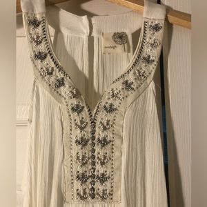 White, beaded, sleeveless shirt, size small, never been worn